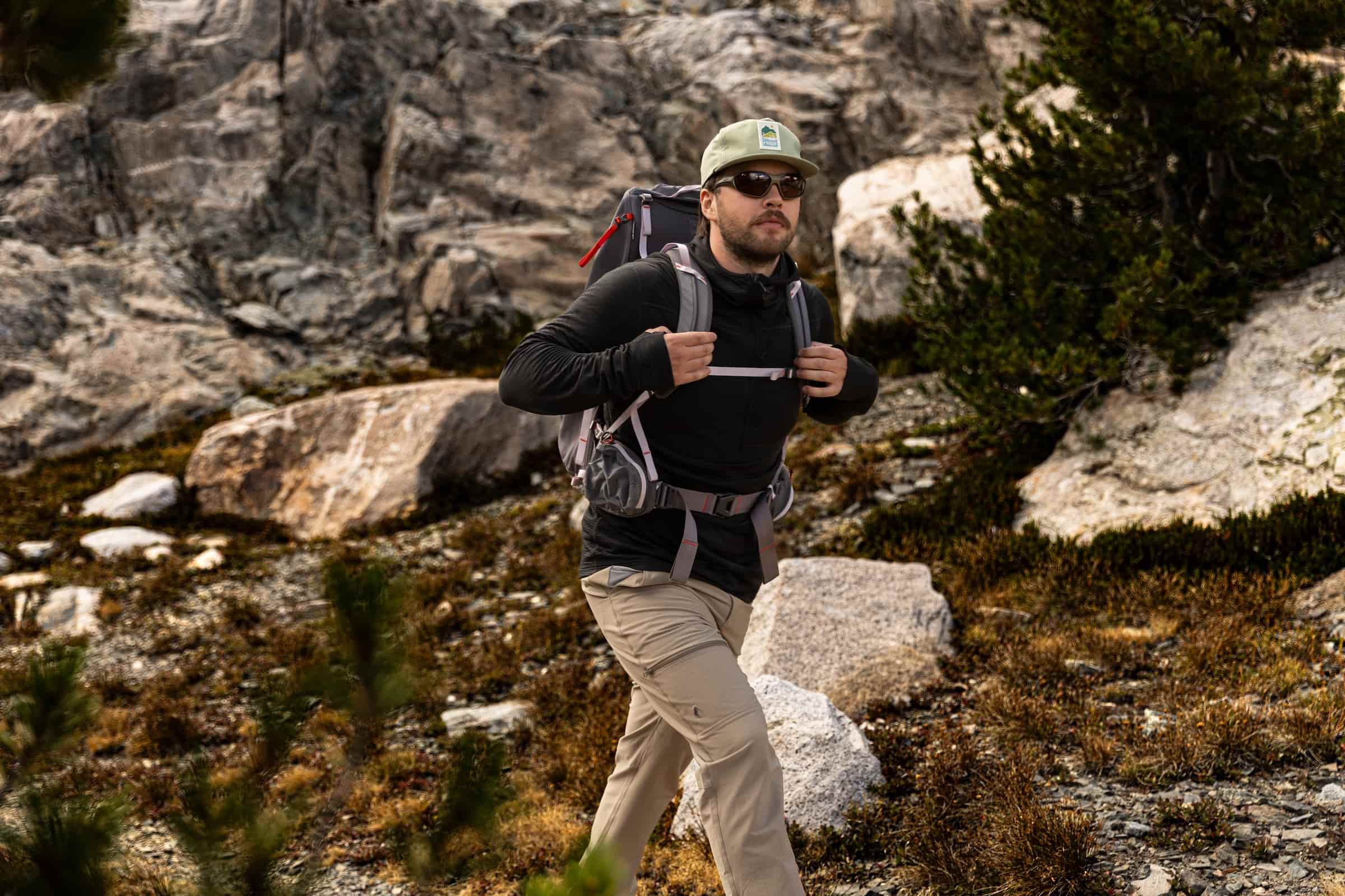a hiker wearing a Convict Canyon Hoodie and a backpack