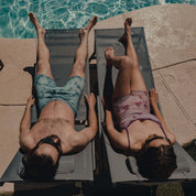 two people hang out by a pool in Ridge Merino tie-dye underwear