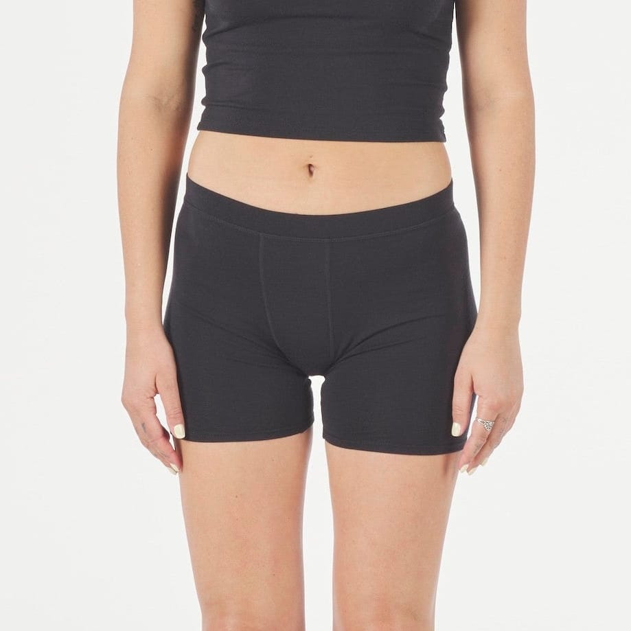 a woman wearing Ridge Merino boy shorts in the longer 5" inseam with a Ridge Merino bralette