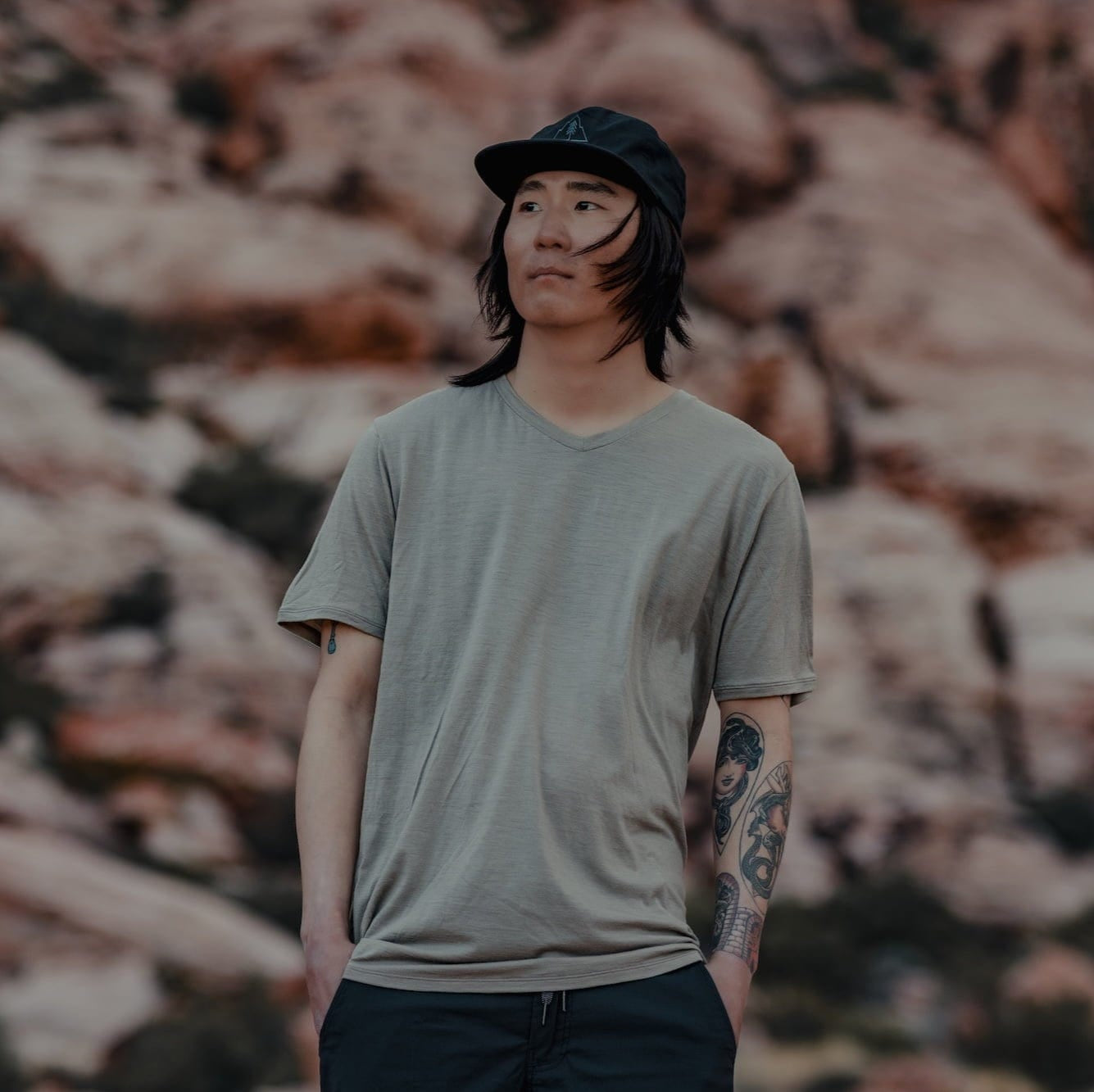 a man wearing a Driftwood Journey V-Neck Tee
