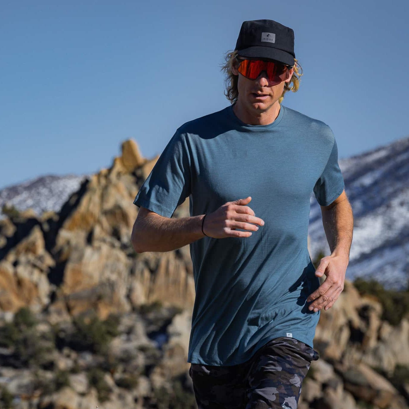 a man running in a Pursuit Ultralight Tee