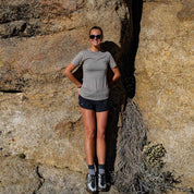 a woman wearing a Pursuit Ultralight Tee on a hike