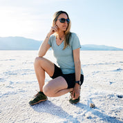 a woman wearing a Wander V-Neck T-Shirt in Death Valley