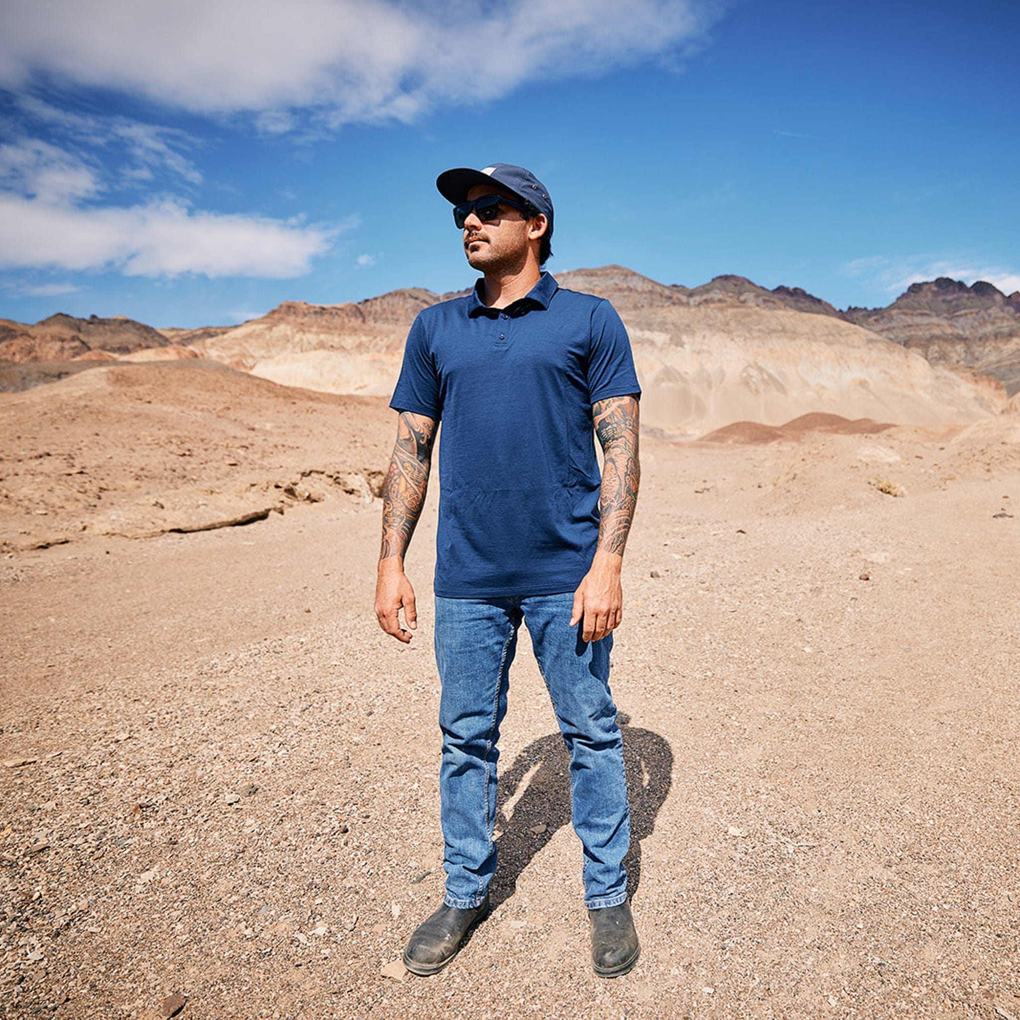 a man wearing a blue Journey Merino Wool Polo Shirt