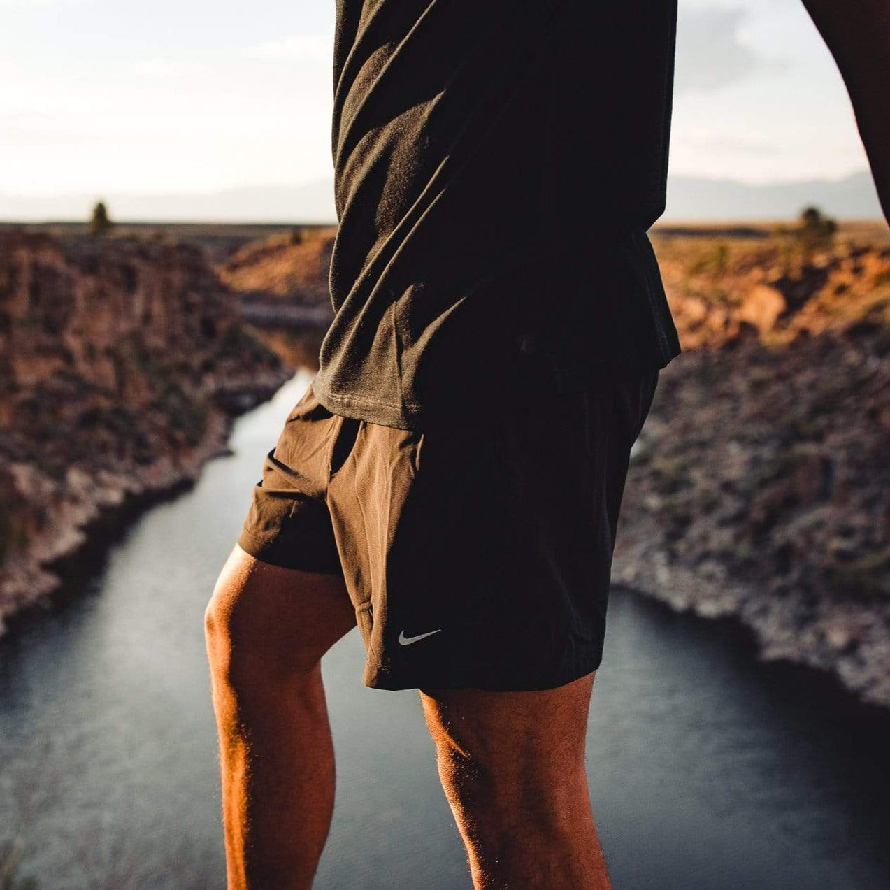 a man wearing the Journey Merino tee and shorts