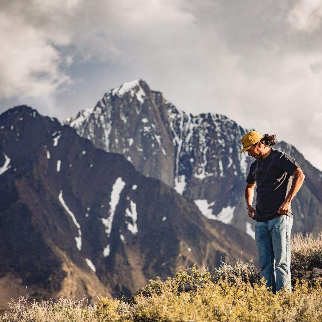 a man wearing the Journey Merino T-Shirt and jeans near Convict Lake