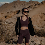 a woman wearing a Send-It Sports Bra and Iva Bell Shorts