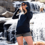 A woman laughs wearing a Natural Tencel Hoodie